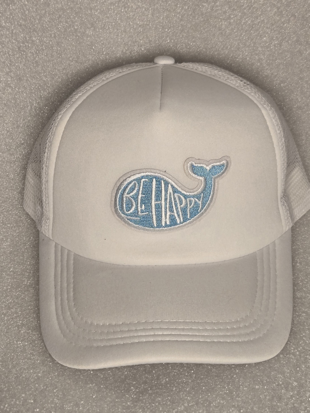 Unisex White Trucker Hat with Blue 'Be Happy' Whale Patch